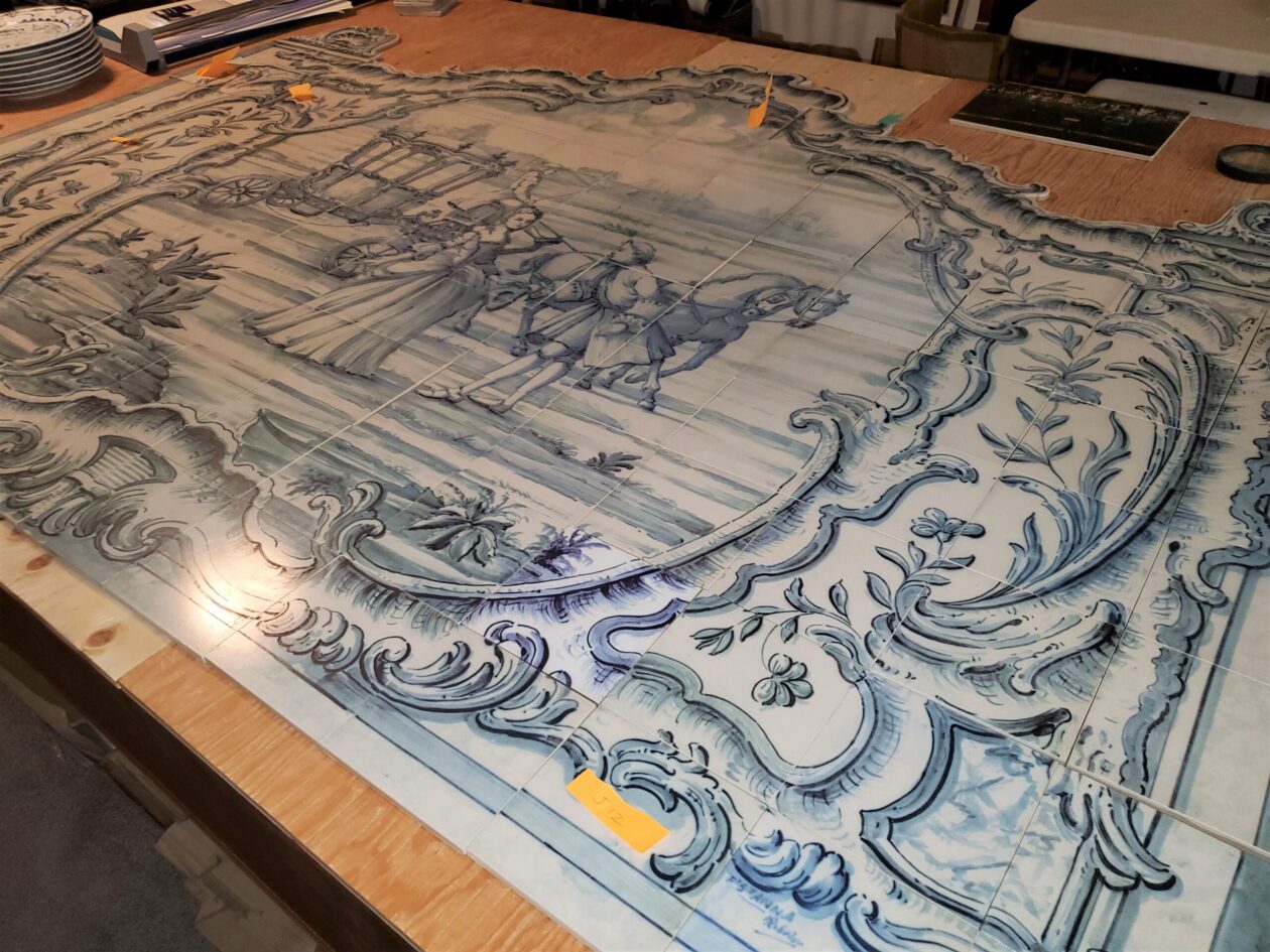 Large custom porcelain tile mural laid out for inspection before shipping